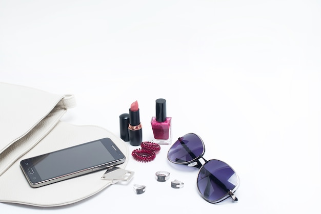 Cosmetics and accessories on a light background