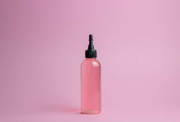 Cosmetics on pink. Minimalism. Skincare.