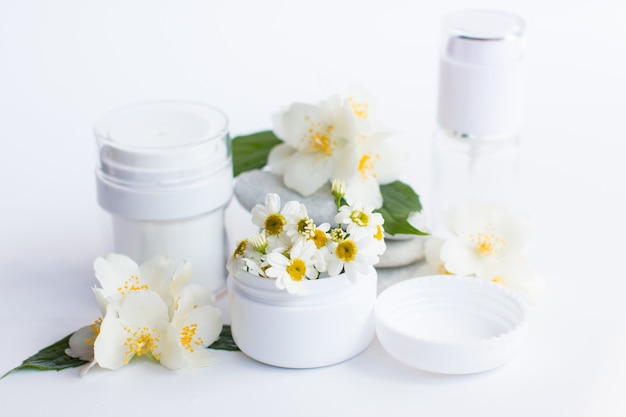 Cosmetics in white jars. Medical spa supplies