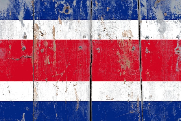 Costa rica flag on a rustic old cracked wooden surface