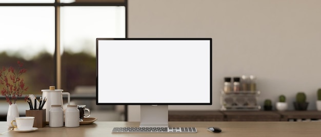 Cosy home workspace with a whitescreen computer mockup and accessories on a wooden desk