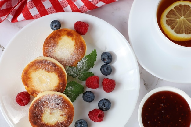 Cottage cheese fritters served with fruit jam