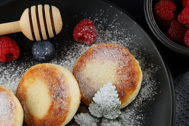 Cottage cheese fritters with raspberry berries Fritters of cottage cheese with berries