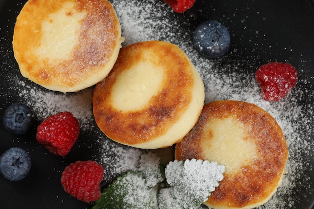 Cottage cheese fritters with raspberry berries Traditional breakfast Tasty and healthy food