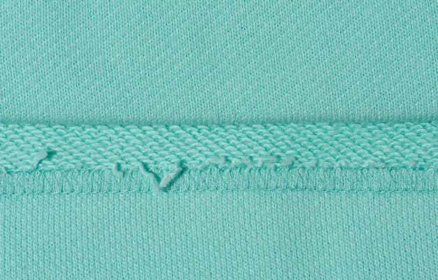 Cotton mintcolored fabric texture for making clothes close up