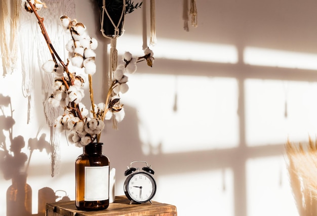 Cotton Stems in a Vase with Clock Horizontal Photo