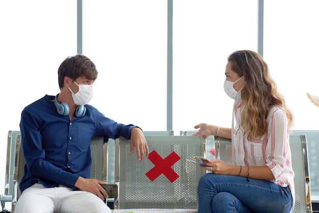 Couple at airport wearing masks