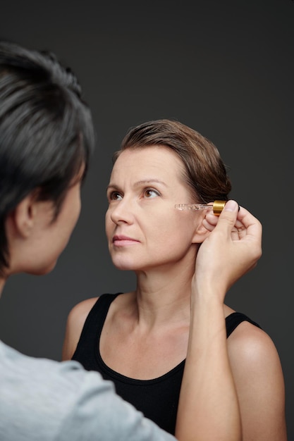 Couple Applying Rejuvenating Serum