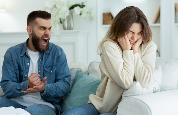 Couple Arguing Husband Shouting To Desperate Wife