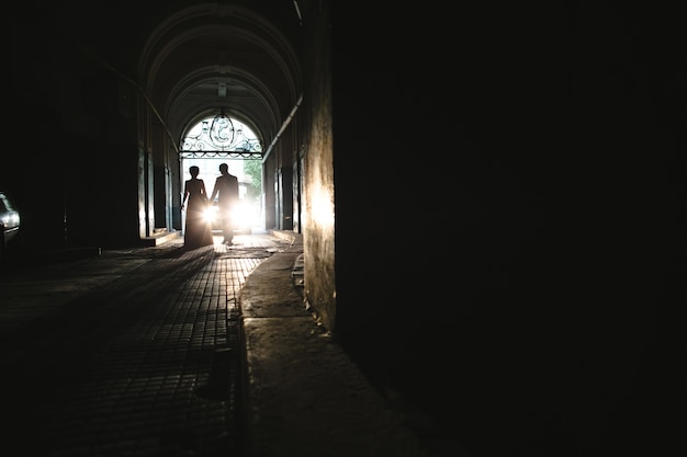 Couple on the background of a dark street