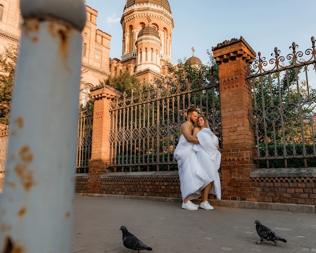 A couple in blankets walking around the city