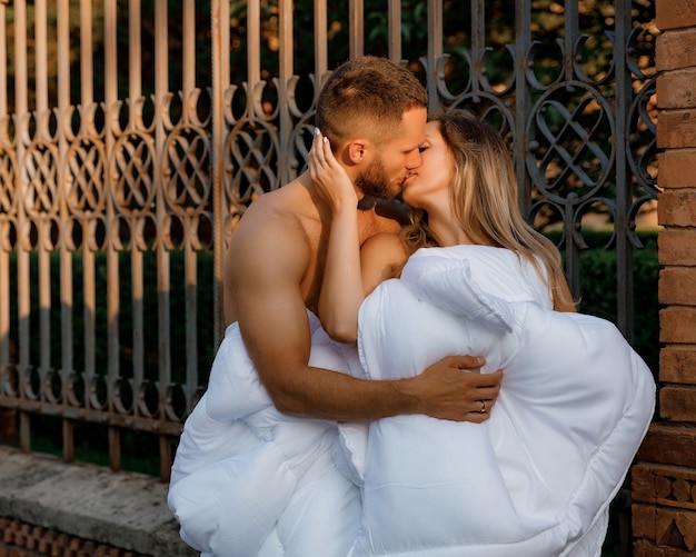 A couple in blankets walking around the city