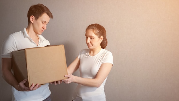 Couple Carrying Boxes Into New Home On Moving Day, sunlight