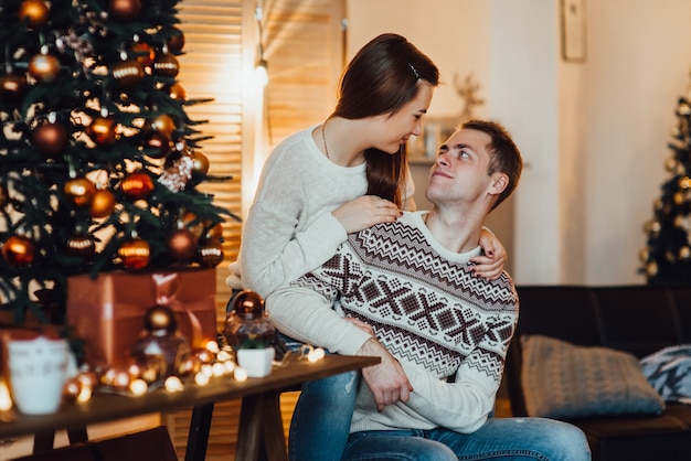 Couple celebrate Christmas in a warm atmosphere at home