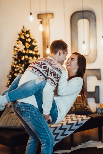 Couple celebrate Christmas in a warm atmosphere at home