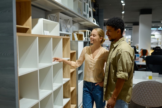 Couple choosing looking for home indoors decoration