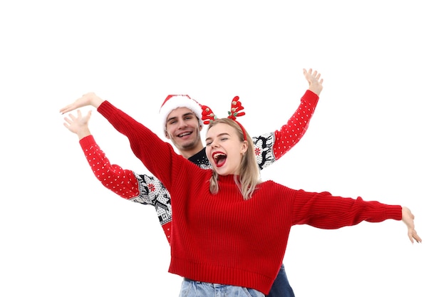 Couple in Christmas clothes isolated on white background