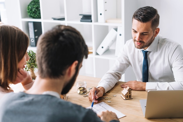 Couple consulting with real estate agent