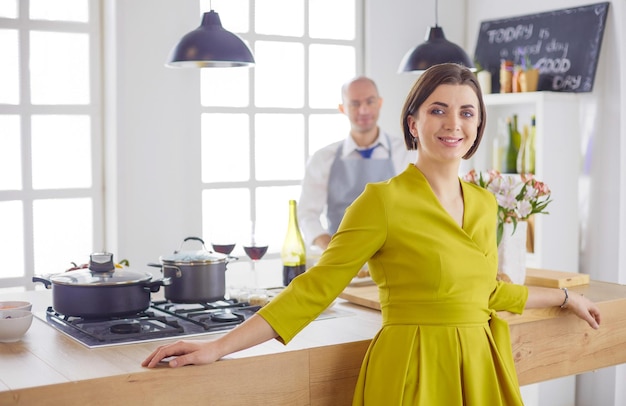 Couple cooking together in the kitchen at home