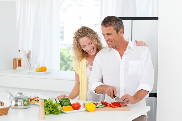 Couple cooking together in their kitchen