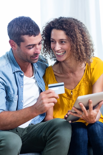 Couple doing online shopping on digital tablet