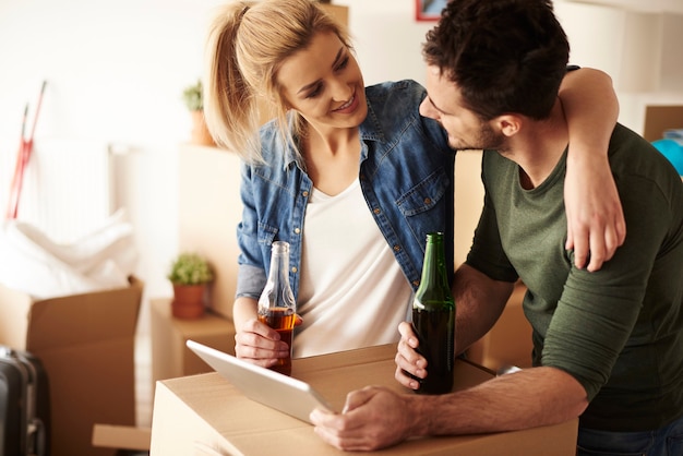 Couple drinking beers and  smiling