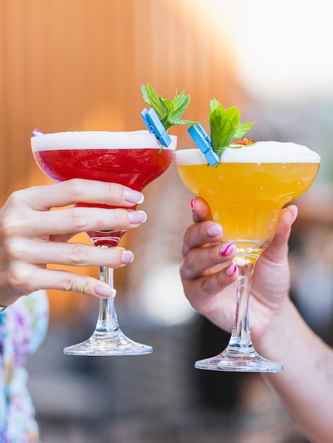 A couple drinking cocktails at a celebration