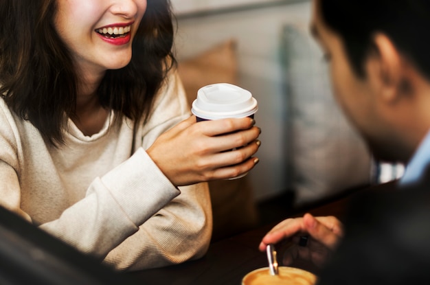 Couple drinking coffee at a cafe