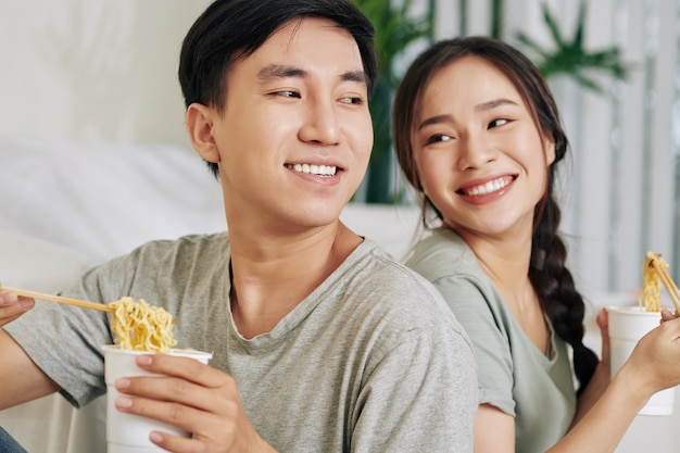 Couple eating ramen soup