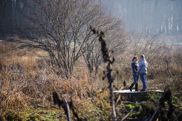 Couple embracing each other outdoors in snow