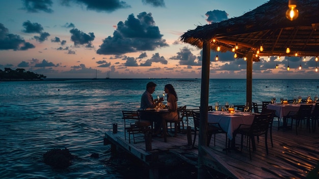 Couple enjoying dinner on private pier with ocean views