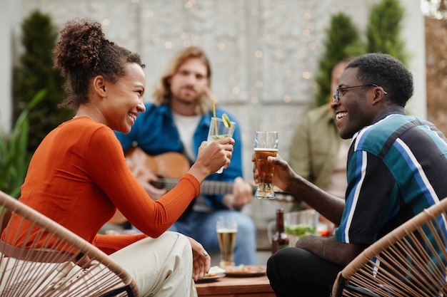 Couple Enjoying Drinks at Rooftop Party