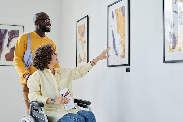 Couple enjoying modern art at gallery