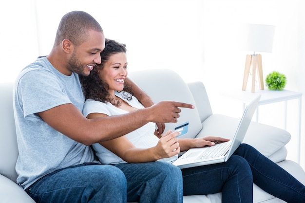 Couple enjoying online shopping