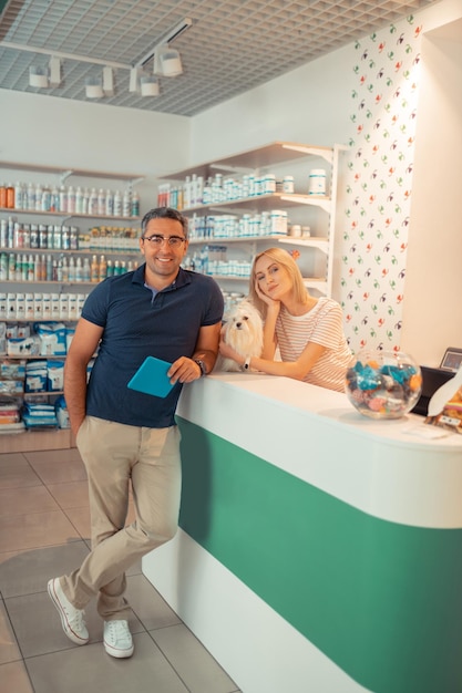 Couple feeling truly happy after opening their own pet shop