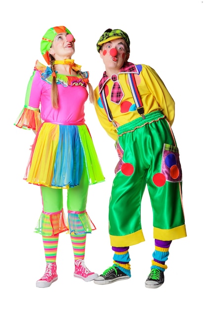 Couple of happy clowns with flowers isolated on the white background