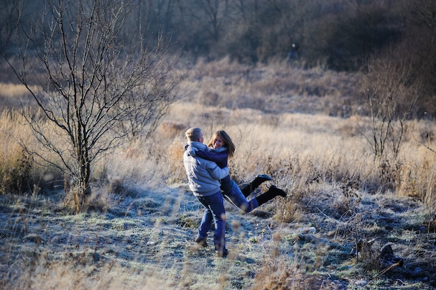 Couple having fun running down slope