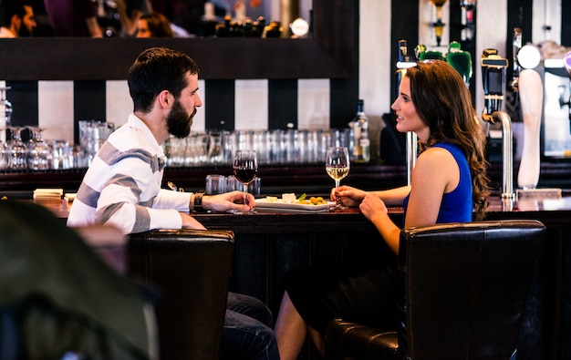 Couple having a glass of wine in a bar