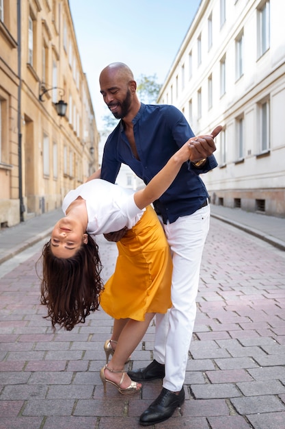 Couple having a latin dance performance in the city