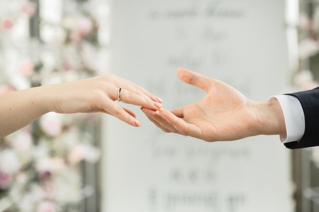 a couple holding hands from the word in the background