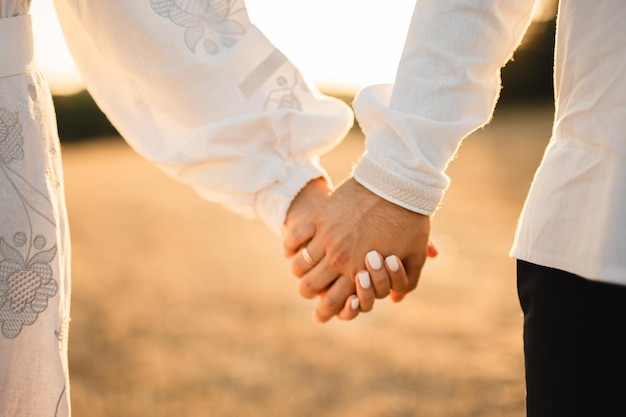 couple holding hands together wedding and engagement concept