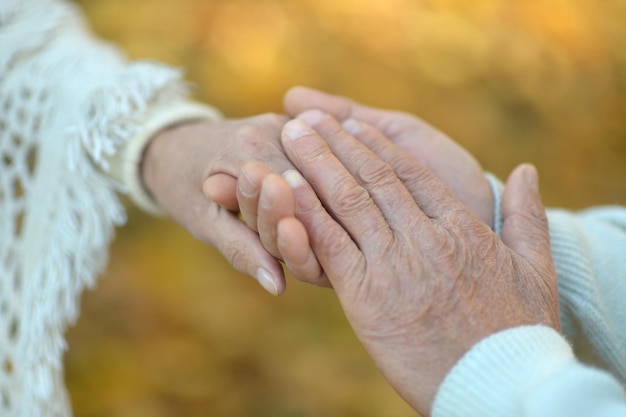 Couple holding hands together