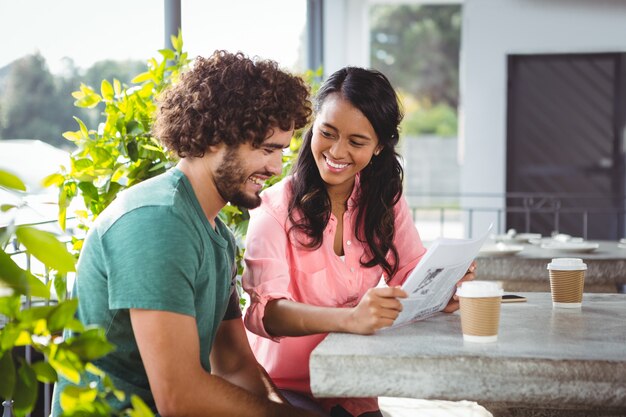 Couple holding menu card