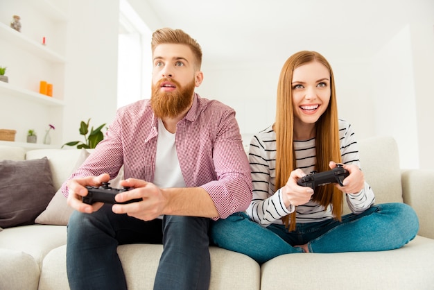 Couple at home playing video games together