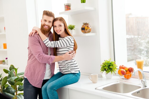 Couple at home sitting together in the kitchen