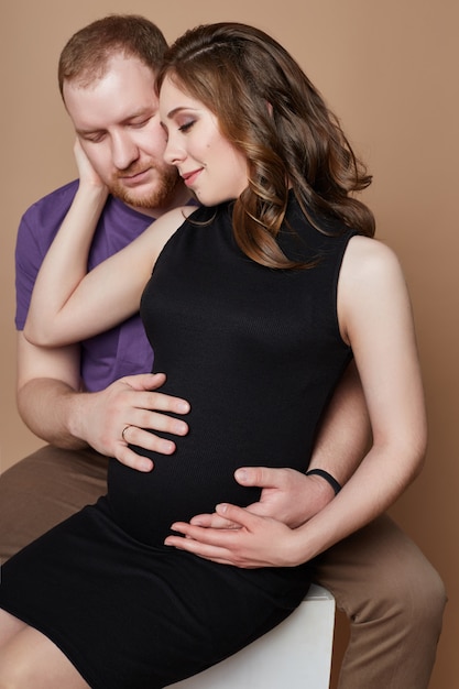 Couple is expecting a baby. Pregnancy and family