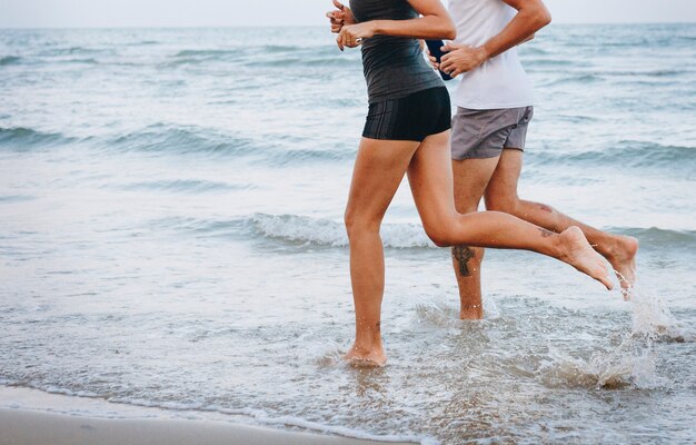 Couple jogging at the beach