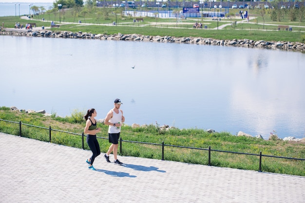 Couple Jogging in City Park Background