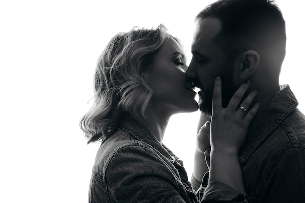 Couple kissing on black silhouette of a couple portrait of a couple close portrait of a couple