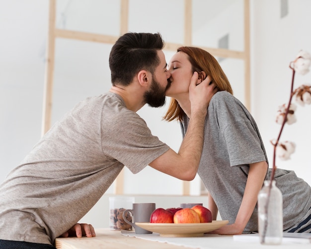 Couple kissing in the morning